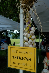 Signs at markets show which vendors accept EBT tokens